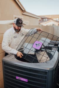 Technician Checking Air Conditioning Unit