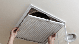 Person changing their home air filter
