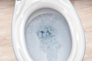 Closeup of flushing toilet bowl