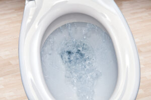 Closeup of flushing toilet bowl