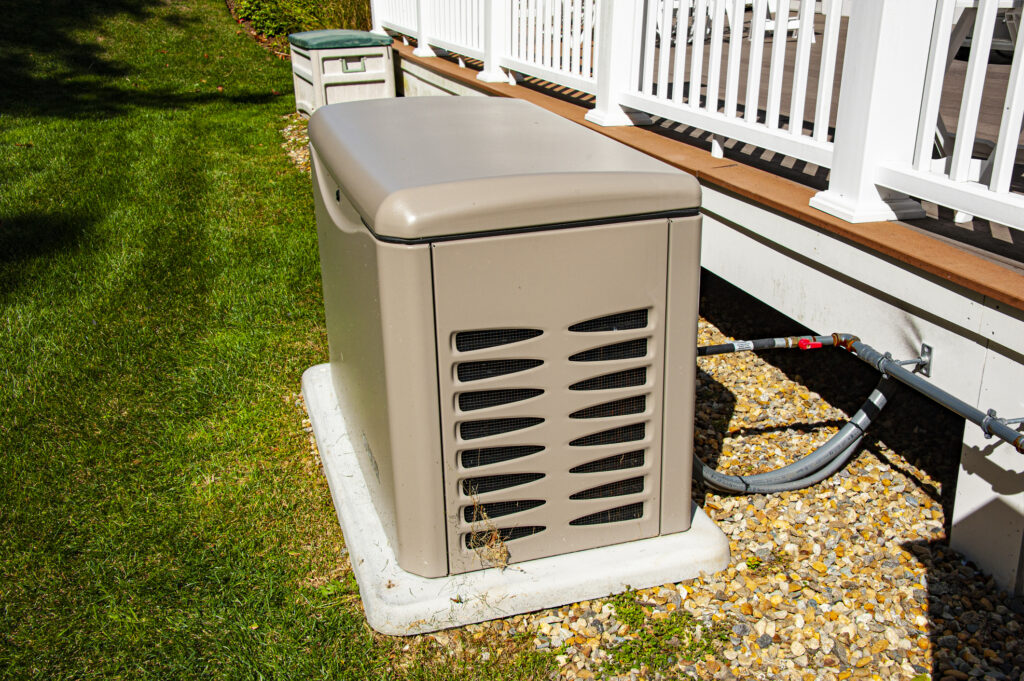 Residential standby generator on concrete pad