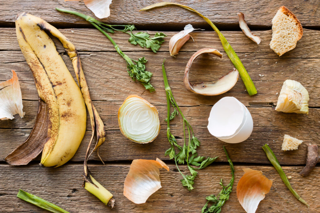 Food waste and leftovers on a wooden background