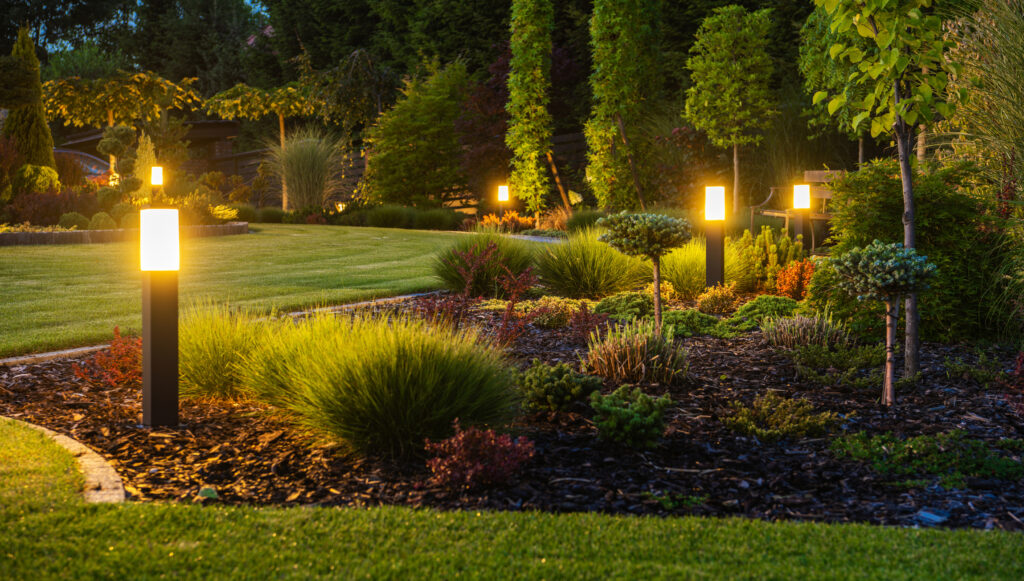 LED Light Posts Illuminated Backyard Garden During Night Hours